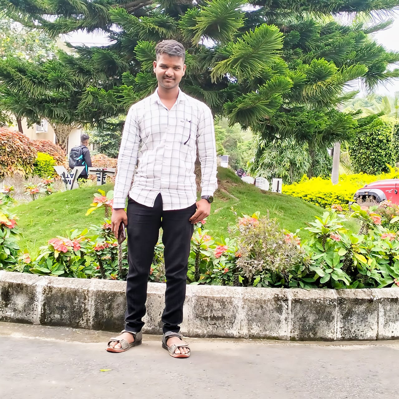 Casual portrait of professional sitting at workspace with laptop and coffee